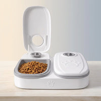 Pawsmee 2-Meal Travel Feeder in white with two timed food compartments for cats and small dogs