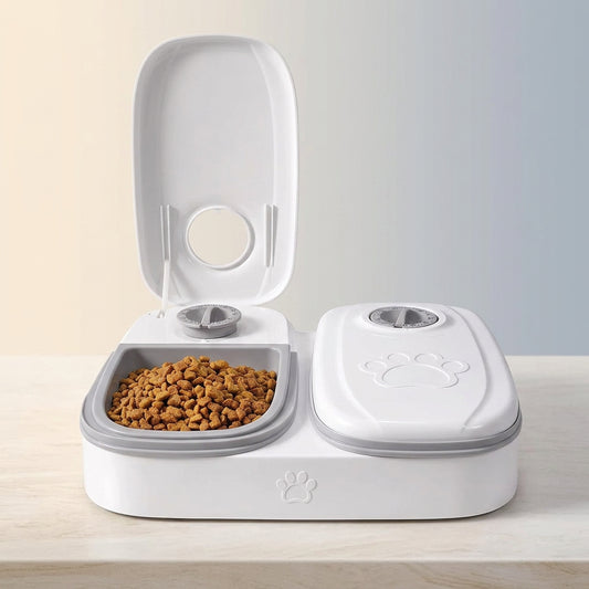 Pawsmee 2-Meal Travel Feeder in white with two timed food compartments for cats and small dogs